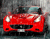 Червоний спортивний автомобіль і дощ