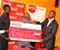 Coca-Cola Kenya Country Manager Rocky Findley Gives Cheque